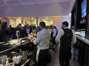 Bartenders working behind the bar during an event