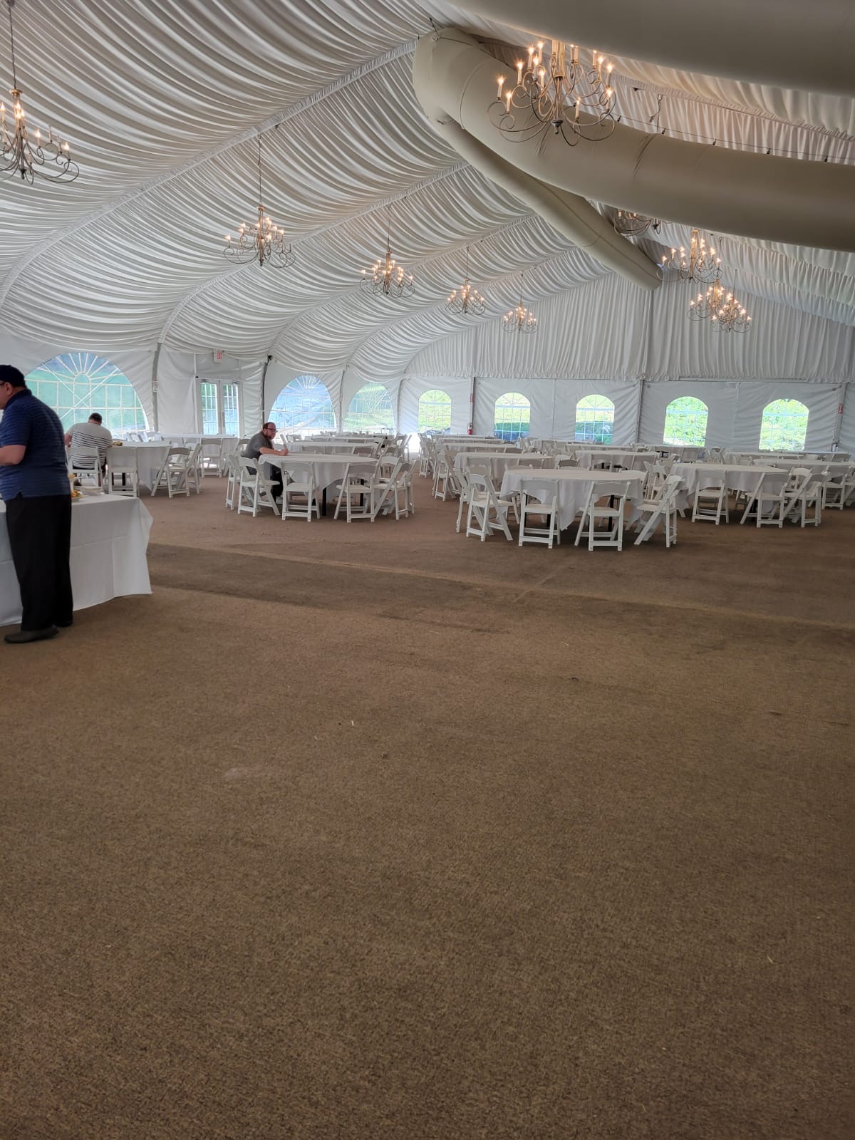 Large white event tent prepared for kosher dining